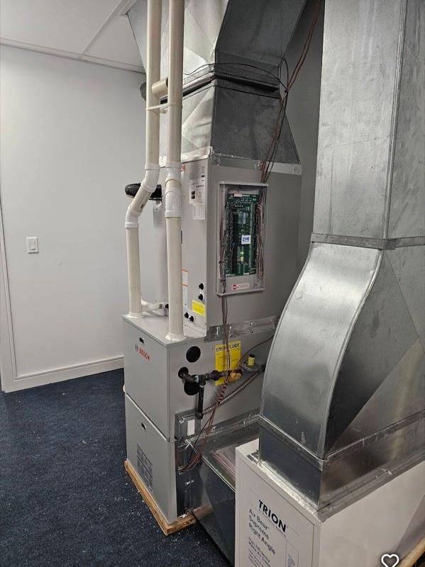 New gas furnace installation in utility room